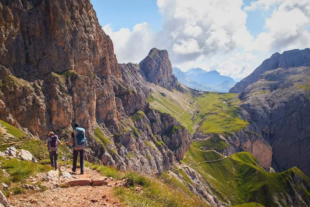 A group of people hiking in the mountains of Schlern-Rosengarten Nature Park  in Italy